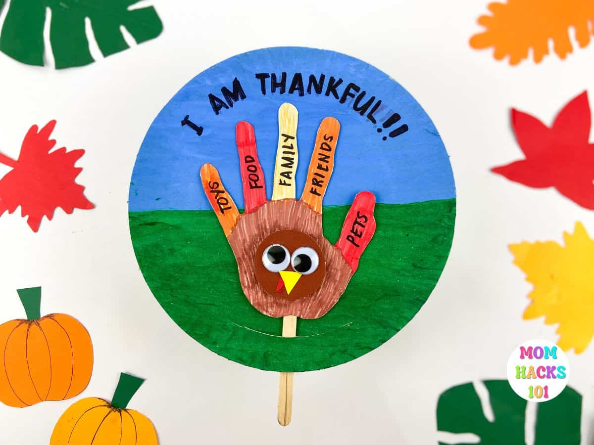 Thankful Turkey Handprint Paper Plate Craft - Mom Hacks 101 throughout Pin The Tail On The Turkey Printable Informational